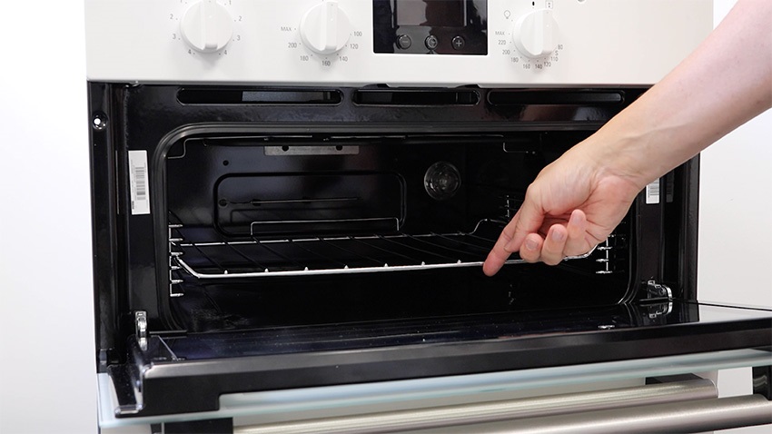 Re-insert any racks and trays into the oven